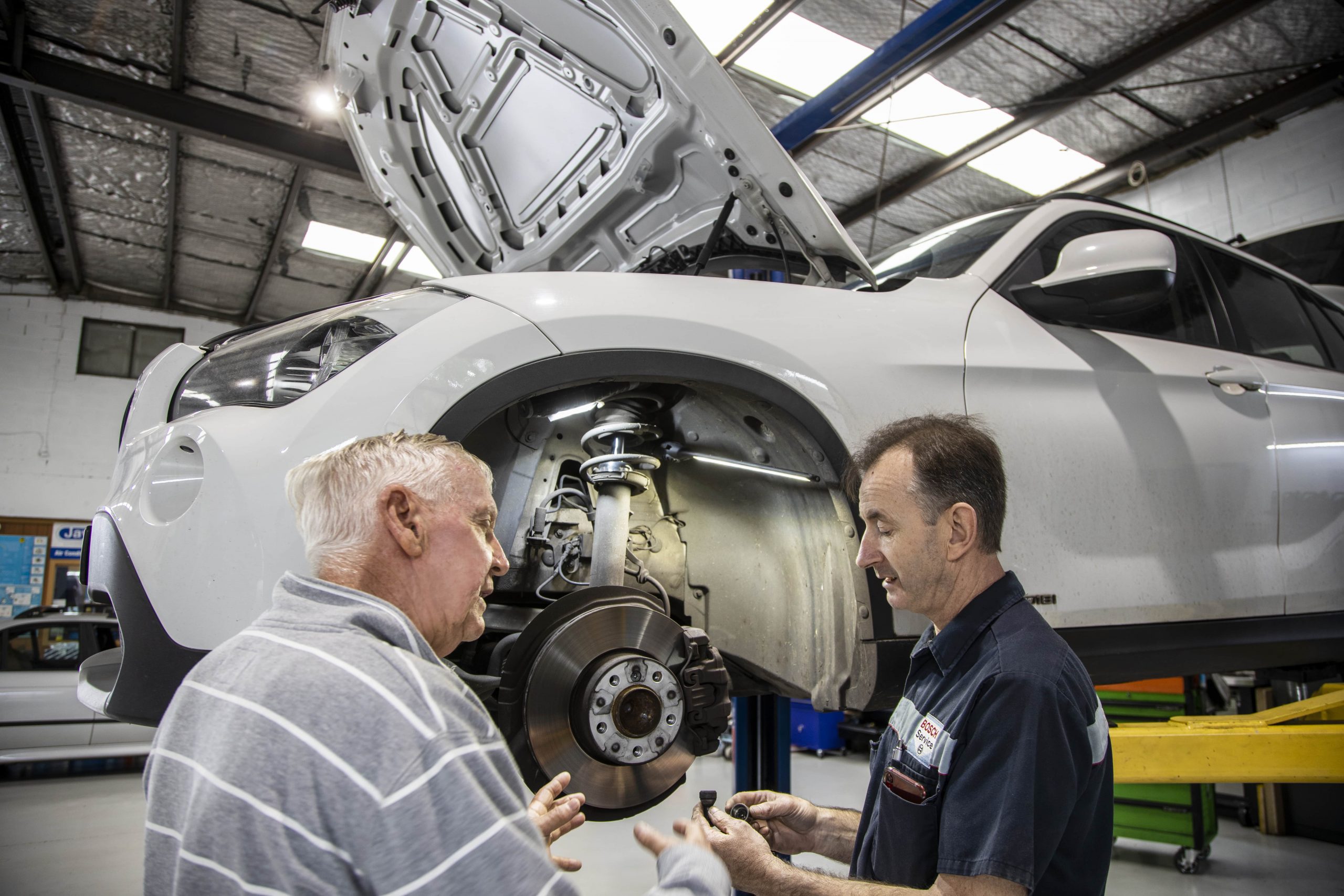 Mechanic Discussing A Brake Service In Bentleigh