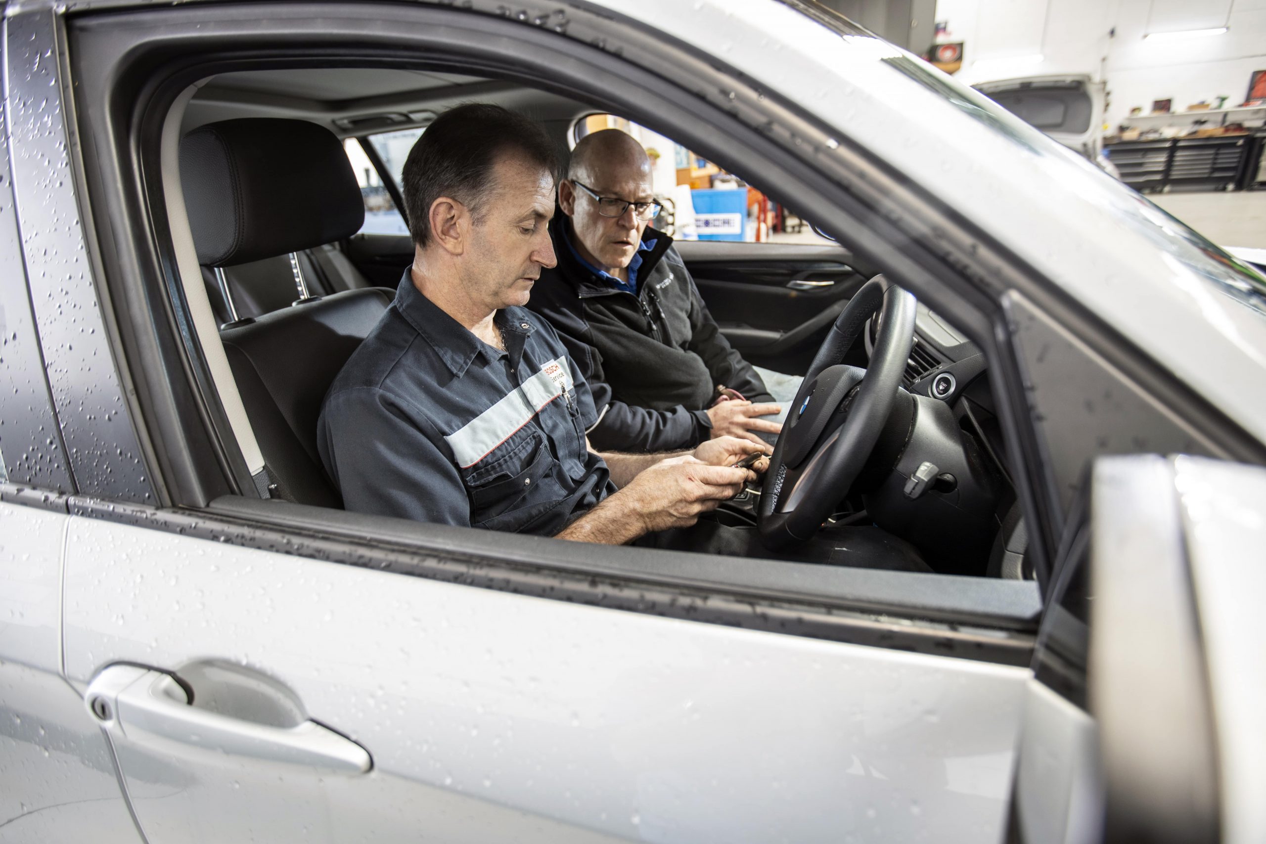 Mechanic Discussing Car Air Conditioning Service In Bentleigh